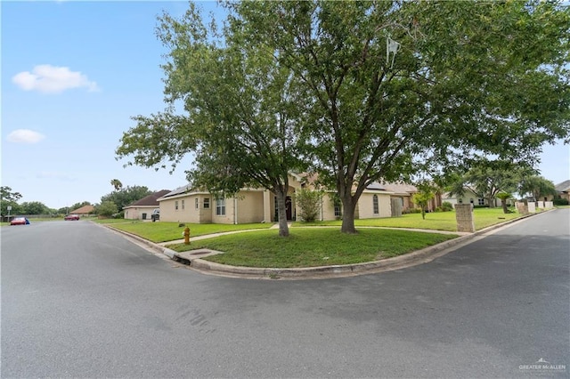 1602 Meadow Ln, Harlingen, TX 78550 - view of front of home featuring a residential view and a front lawn