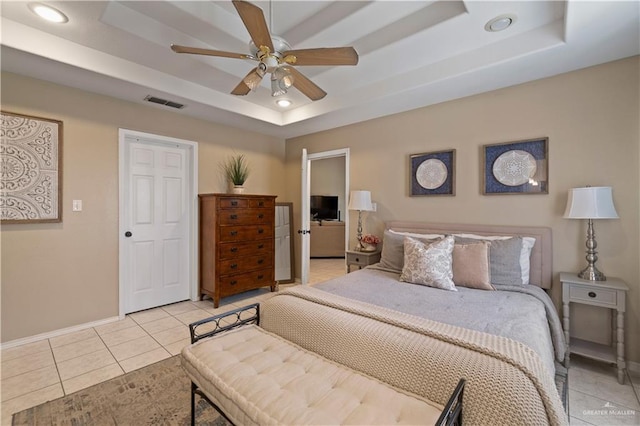 1602 Meadow Ln, Harlingen, TX 78550 - bedroom with a tray ceiling, light tile patterned flooring, baseboards, recessed lighting, and a ceiling fan