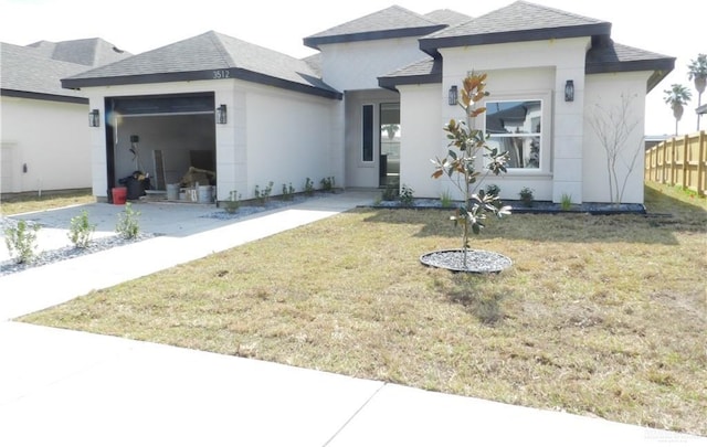 prairie-style house with a front lawn and a garage