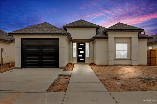 prairie-style home featuring a garage