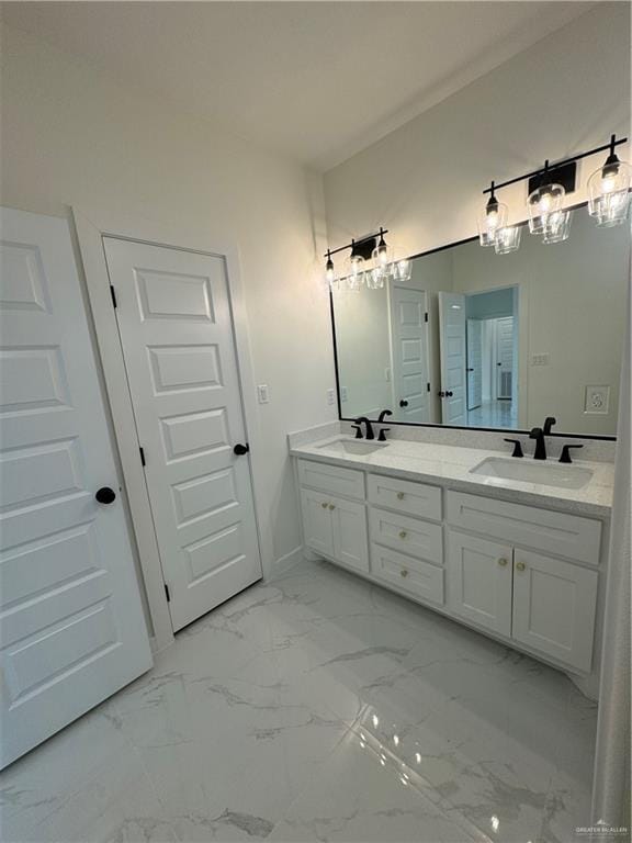 805 E Costa Del Sol Ave, Edinburg, TX 78542 - full bath with a sink, double vanity, and marble finish floor