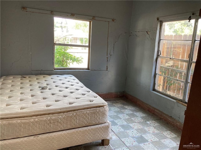 bedroom featuring multiple windows