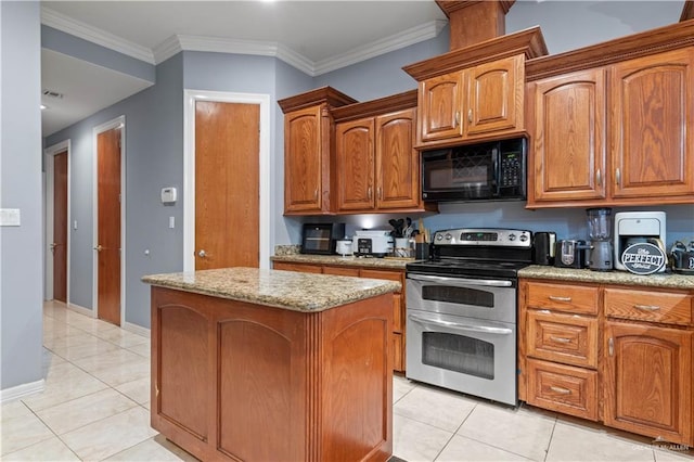kitchen featuring a center island, black microwave, double oven range, and light tile patterned floors