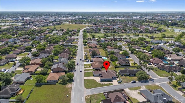 birds eye view of property with a residential view