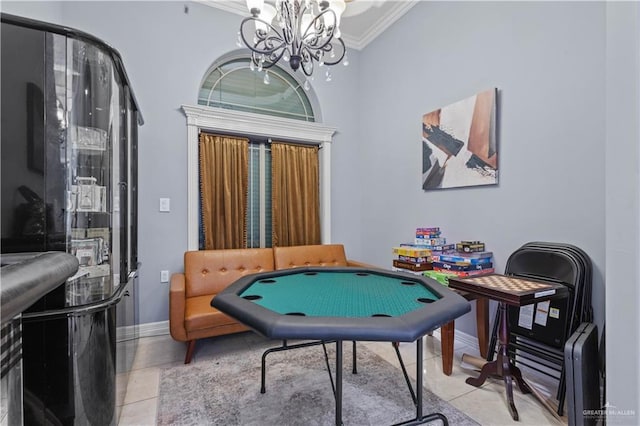 playroom featuring a notable chandelier, baseboards, ornamental molding, and light tile patterned flooring