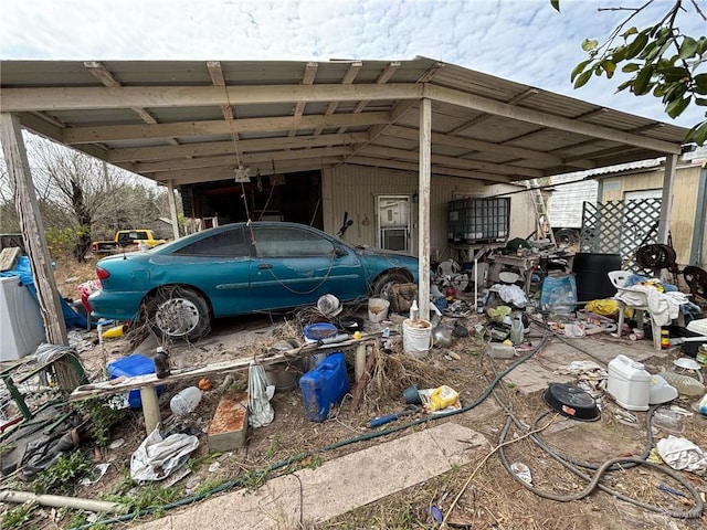 view of vehicle parking featuring an attached carport