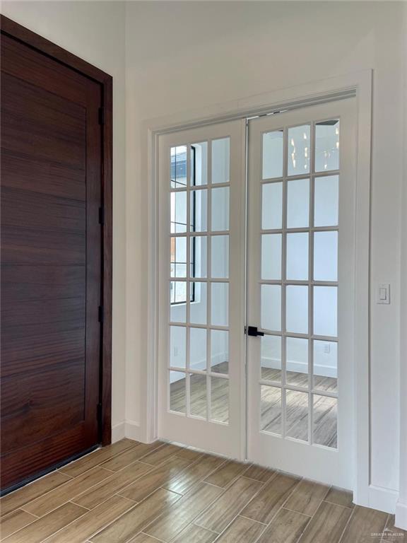 entryway featuring french doors and light hardwood / wood-style floors