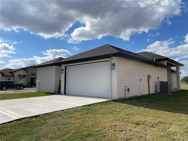 view of side of property featuring an attached garage, cooling unit, a yard, concrete driveway, and stucco siding