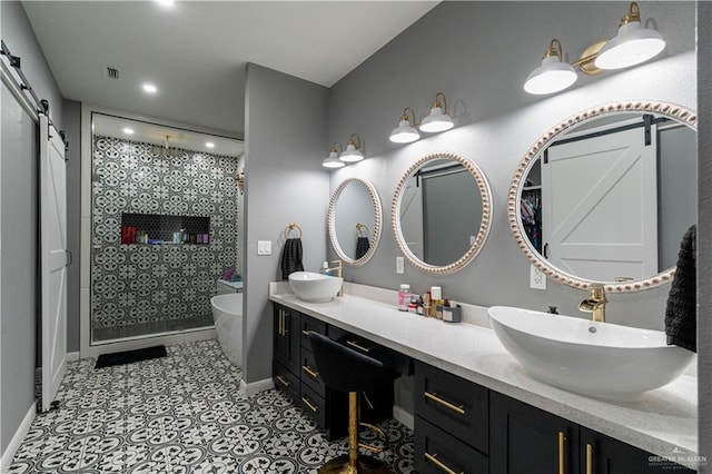 bathroom with tile patterned floors, vanity, and separate shower and tub