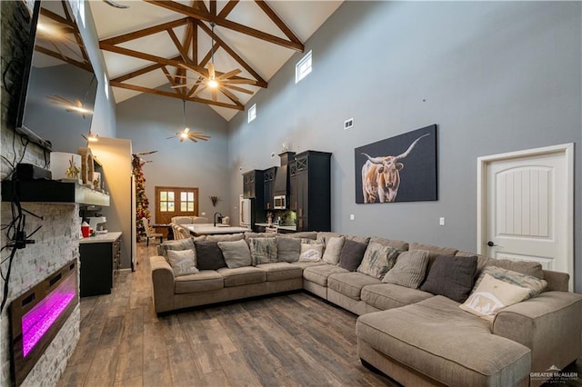 living room featuring dark hardwood / wood-style floors and high vaulted ceiling