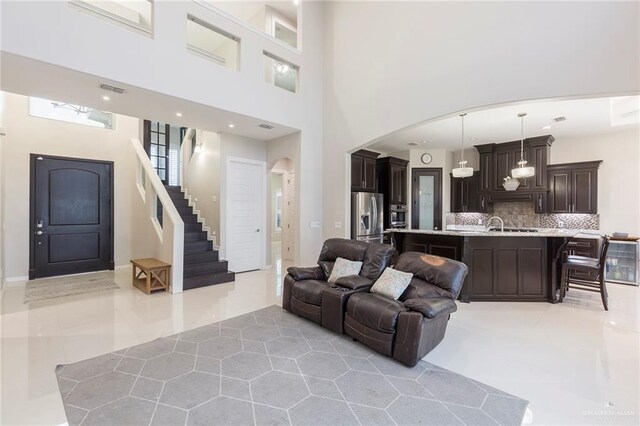 living room with a high ceiling