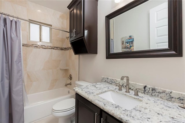 full bathroom with vanity, toilet, and shower / tub combo with curtain