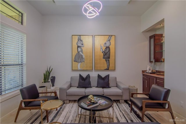 living room with an inviting chandelier