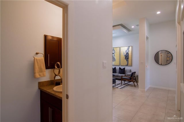 bathroom with tile patterned flooring and vanity