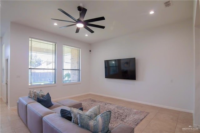 living room featuring ceiling fan and light tile patterned floors