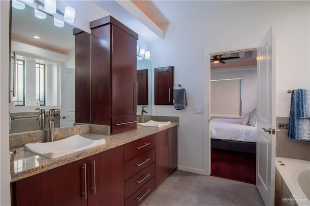 bathroom featuring vanity, tile patterned floors, ceiling fan, and a tub