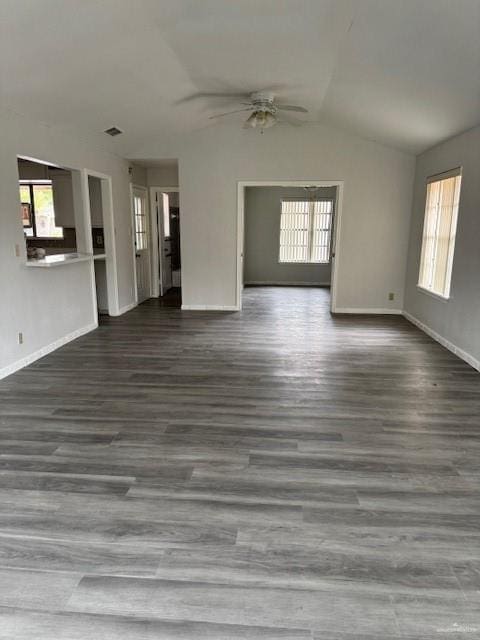 unfurnished living room with lofted ceiling, ceiling fan, and wood-type flooring