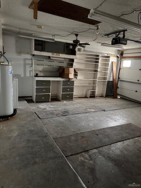 garage with a garage door opener and gas water heater