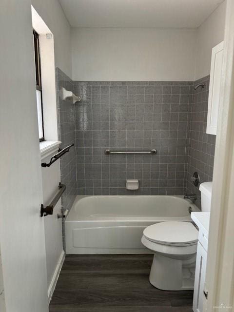 full bathroom featuring vanity, hardwood / wood-style floors, and tiled shower / bath combo