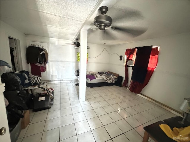 bedroom featuring light tile patterned floors and ceiling fan