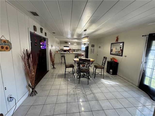 dining area featuring light tile patterned flooring