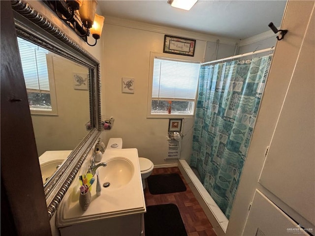 bathroom featuring walk in shower, toilet, vanity, and hardwood / wood-style flooring