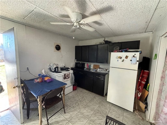 kitchen with ceiling fan and white appliances