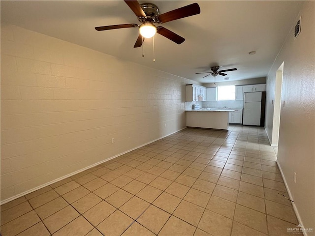 225 N 28th St, Mcallen, TX 78501 - unfurnished living room featuring light tile patterned flooring, a ceiling fan, and baseboards