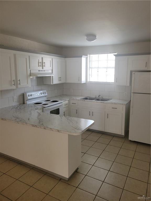 225 N 28th St, Mcallen, TX 78501 - kitchen featuring white appliances, under cabinet range hood, a sink, white cabinetry, and tasteful backsplash