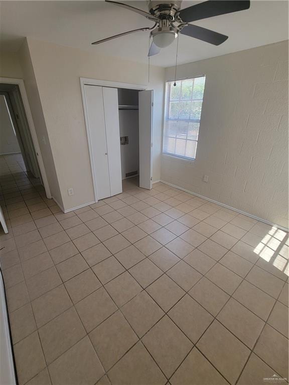 225 N 28th St, Mcallen, TX 78501 - unfurnished bedroom with a closet, ceiling fan, and light tile patterned floors