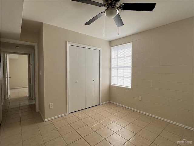 225 N 28th St, Mcallen, TX 78501 - unfurnished bedroom featuring light tile patterned floors, a closet, baseboards, and a ceiling fan