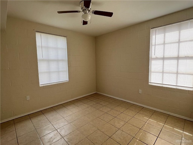 225 N 28th St, Mcallen, TX 78501 - empty room with ceiling fan, light tile patterned floors, and plenty of natural light