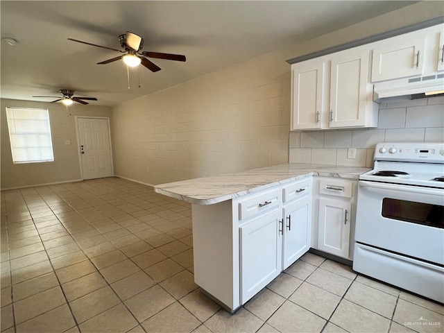 225 N 28th St, Mcallen, TX 78501 - kitchen featuring white electric range, under cabinet range hood, a peninsula, light tile patterned floors, and a ceiling fan