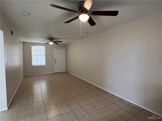 225 N 28th St, Mcallen, TX 78501 - spare room featuring ceiling fan, light tile patterned floors, baseboards, and a smoke detector