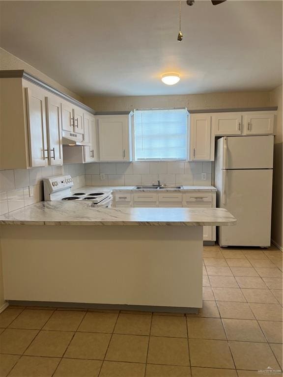 225 N 28th St, Mcallen, TX 78501 - kitchen with white appliances, a sink, a peninsula, exhaust hood, and white cabinets