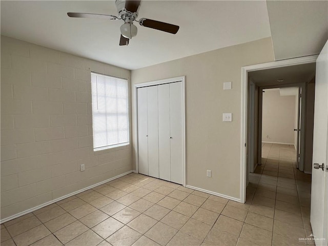 225 N 28th St, Mcallen, TX 78501 - unfurnished bedroom featuring light tile patterned floors, a closet, a ceiling fan, and baseboards