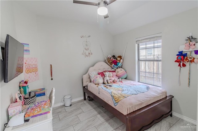 bedroom with ceiling fan and baseboards