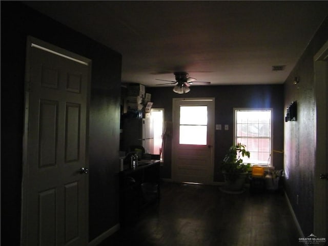 501 W Lovett St, Edinburg, TX 78541 - interior space featuring visible vents, ceiling fan, and dark wood-style flooring