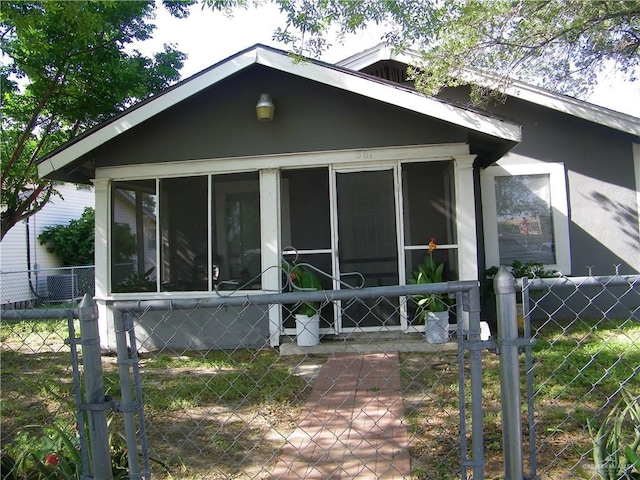 501 W Lovett St, Edinburg, TX 78541 - view of front of house featuring a sunroom and fence
