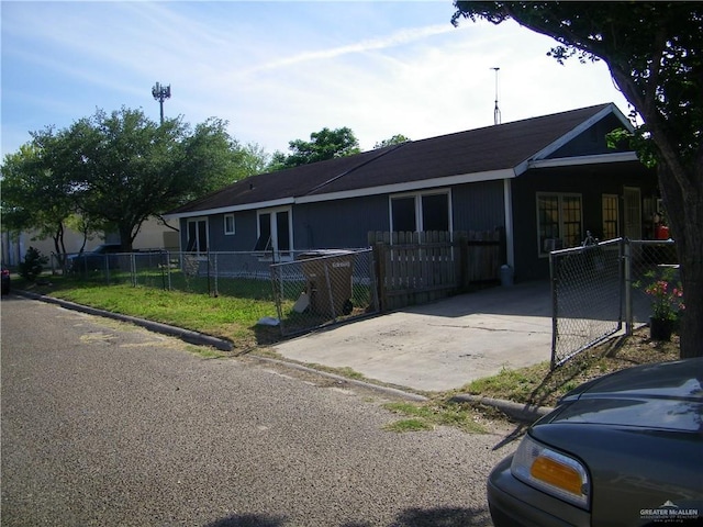 501 W Lovett St, Edinburg, TX 78541 - view of front of property featuring driveway, a carport, and fence private yard