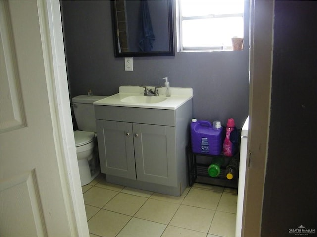 501 W Lovett St, Edinburg, TX 78541 - bathroom featuring vanity, toilet, and tile patterned flooring