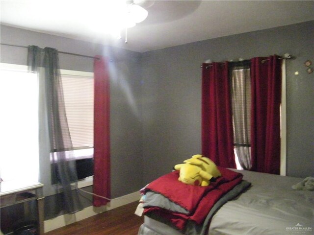 501 W Lovett St, Edinburg, TX 78541 - bedroom with a ceiling fan and wood finished floors
