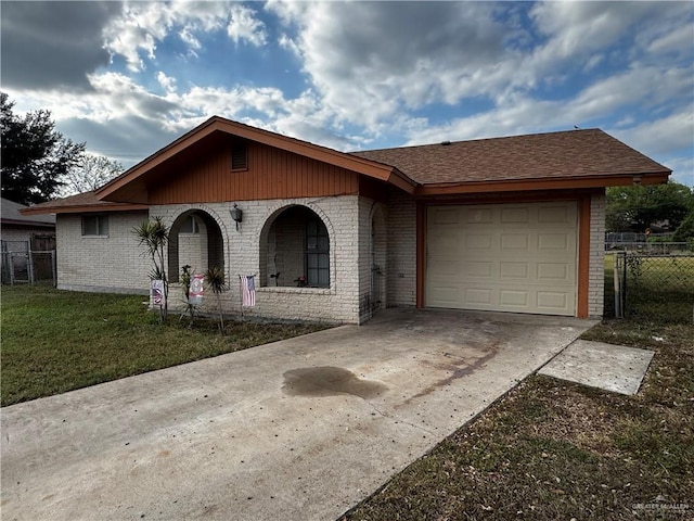 single story home featuring a garage and a front lawn