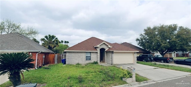 single story home featuring a garage and a front lawn