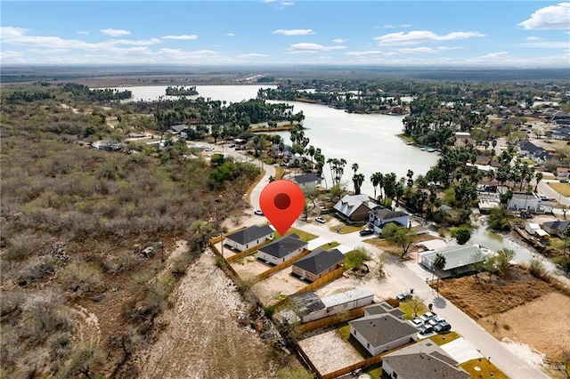 drone / aerial view with a water view and a residential view