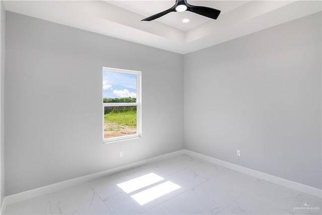 1326 S 9th St, Alamo, TX 78516 - spare room with light marble finish flooring, baseboards, a raised ceiling, recessed lighting, and ceiling fan