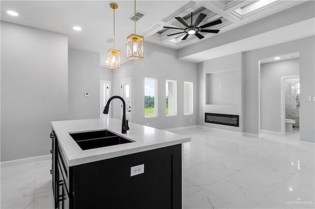 1326 S 9th St, Alamo, TX 78516 - kitchen featuring a sink, light marble finish floors, coffered ceiling, baseboards, and recessed lighting