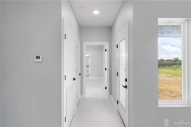 1326 S 9th St, Alamo, TX 78516 - hall featuring light marble finish flooring and baseboards