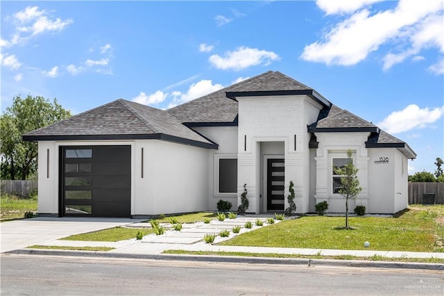 1326 S 9th St, Alamo, TX 78516 - view of front of house with a garage, roof with shingles, and driveway