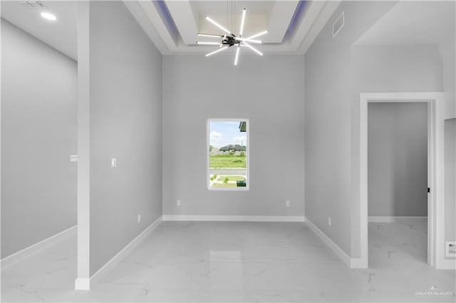 1326 S 9th St, Alamo, TX 78516 - unfurnished room with marble look tiles, a chandelier, and baseboards